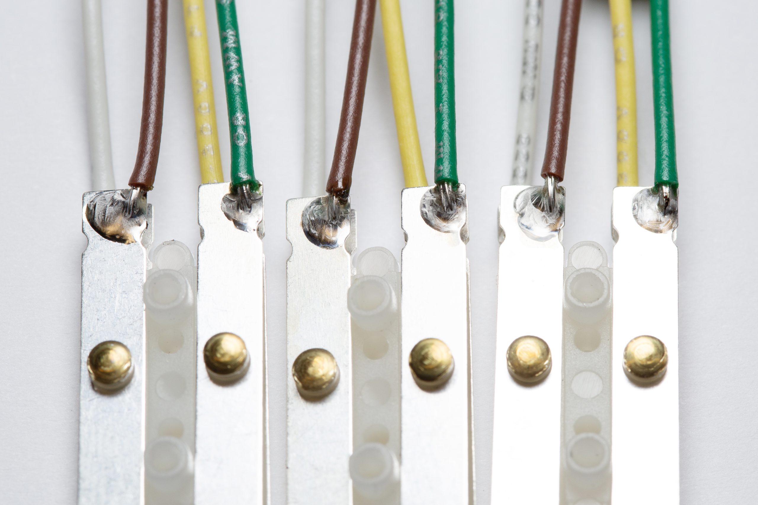 Lead wires soldered to silver plated phosphor bronze blade with RoHs compliant solder, Chicago soldering service, lead wire soldering service, RoHs soldering service Chicago, soldering service USA, solder assemblies, solder connections Chicago,