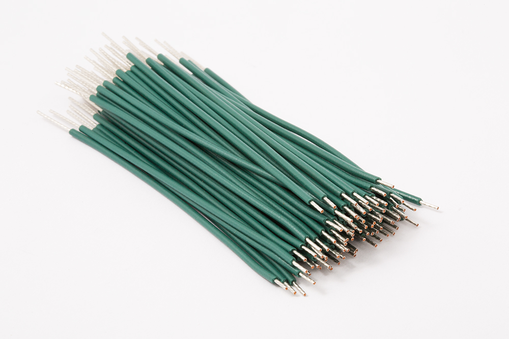 Lead wires with green PVC jacket, 1/4" stripped lead wire by automated wire stripping machine. Lead wires cut by automated wire cutting machine.